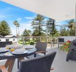 Bathers at the Beach across from Surf Beach