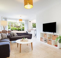 Light and airy garden apartment steps from surf - C Tourism